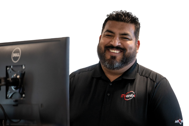 Three co-workers looking at a laptop searching for Managed IT Support Services in Georgia.