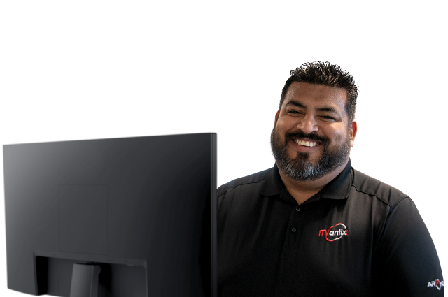 Three co-workers looking at a laptop searching for Managed IT Support Services in Georgia.